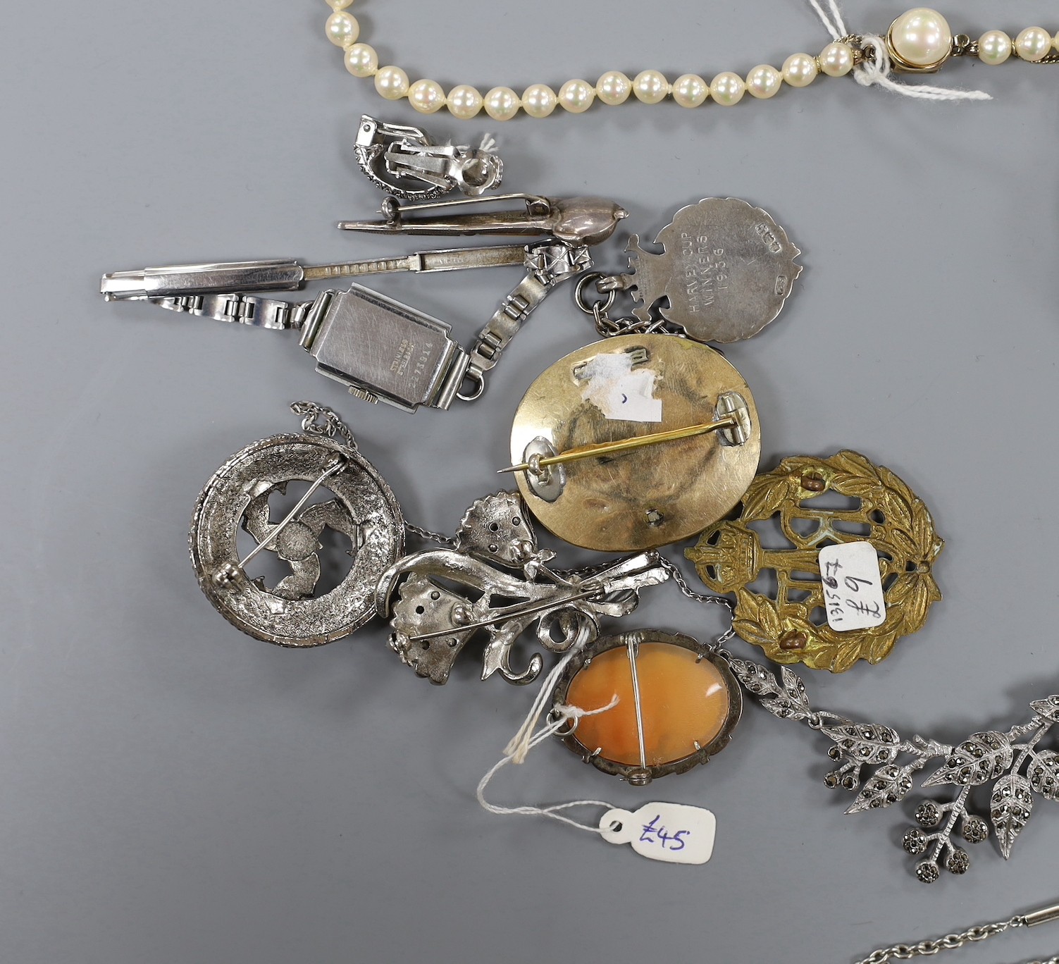 A mixed group of assorted silver and costume jewellery including a silver albert, Scottish hardstone brooch and two silver medallions, a silver fob watch, a white metal open faced pocket watch and a lady's steel Talis wr